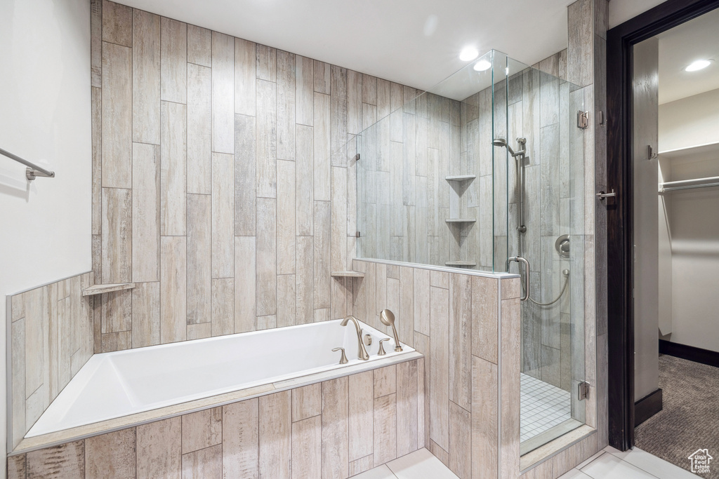 Bathroom with plus walk in shower and tile patterned floors