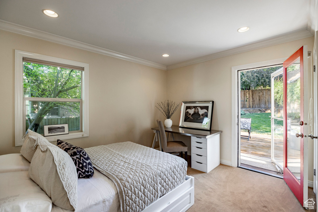 Bedroom with light carpet, access to exterior, and ornamental molding