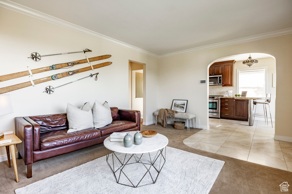 Tiled living room featuring ornamental molding