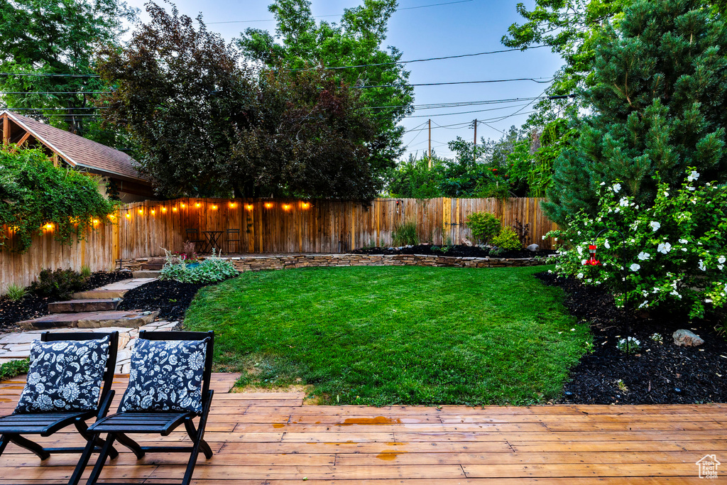 View of yard featuring a wooden deck