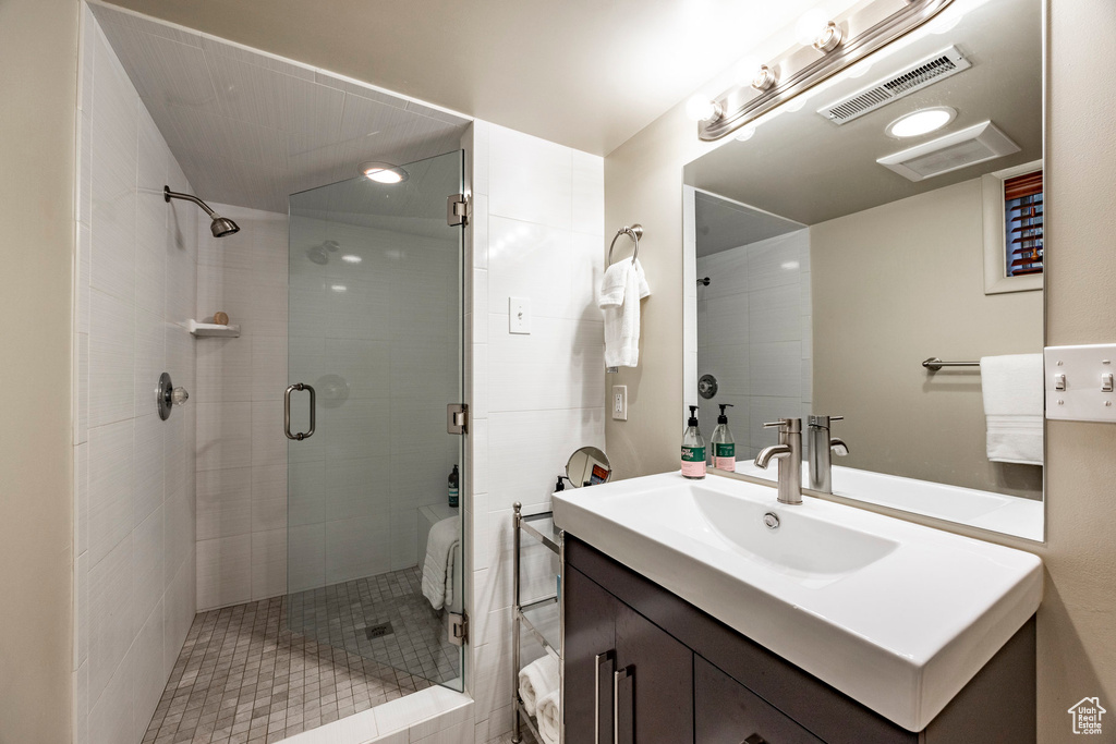 Bathroom with walk in shower and vanity