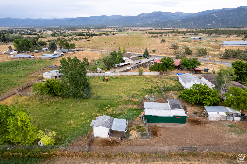 Birds eye view of property featuring a mountain view and a rural view