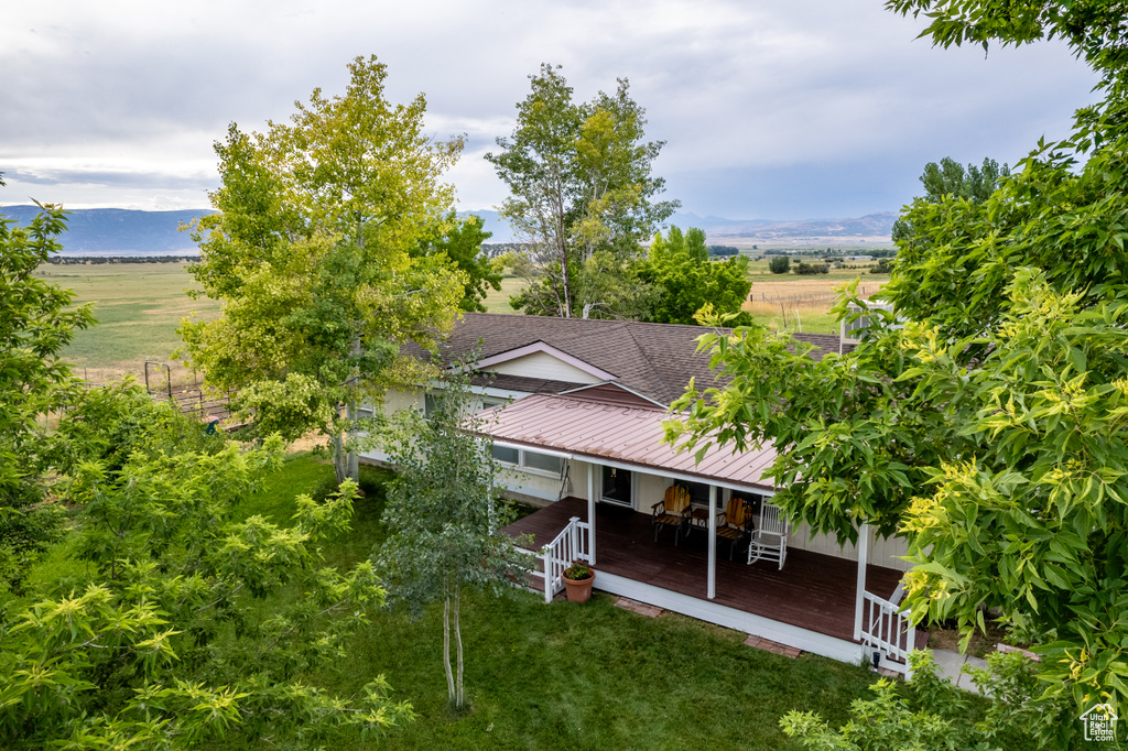 Birds eye view of property with a mountain view and a rural view