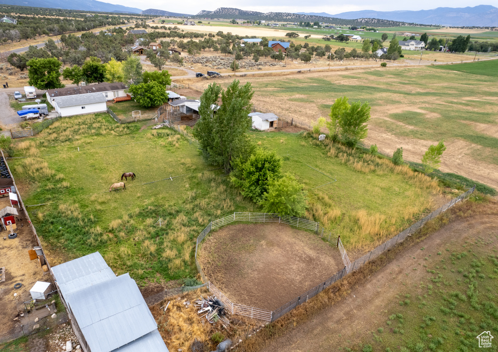 Birds eye view of property with a mountain view and a rural view