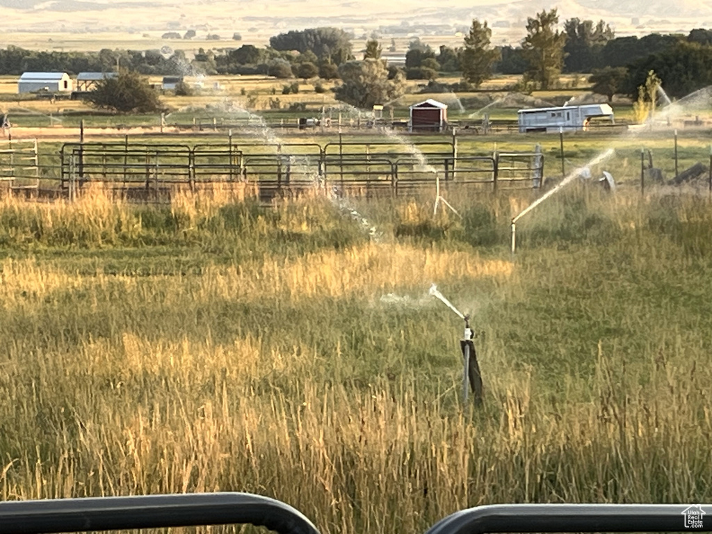 View of yard with a rural view