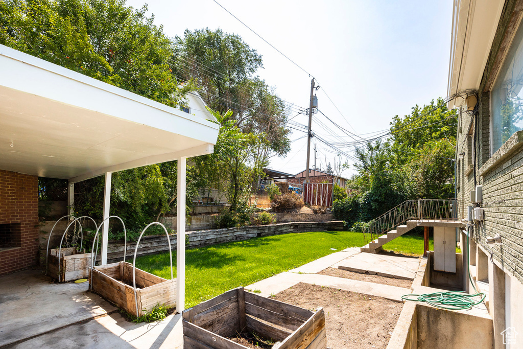 View of yard with a patio area