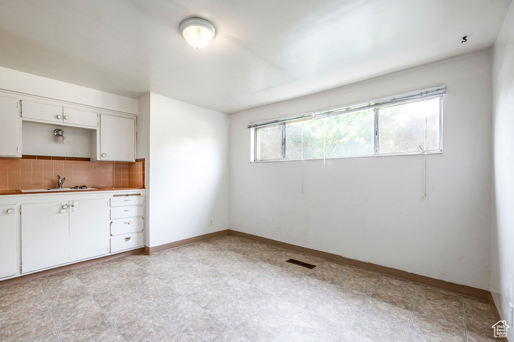 Interior space with sink and light tile patterned floors