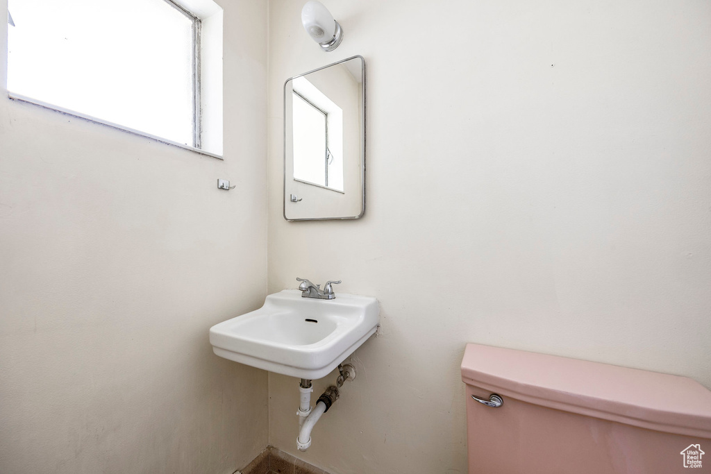 Bathroom featuring sink and toilet