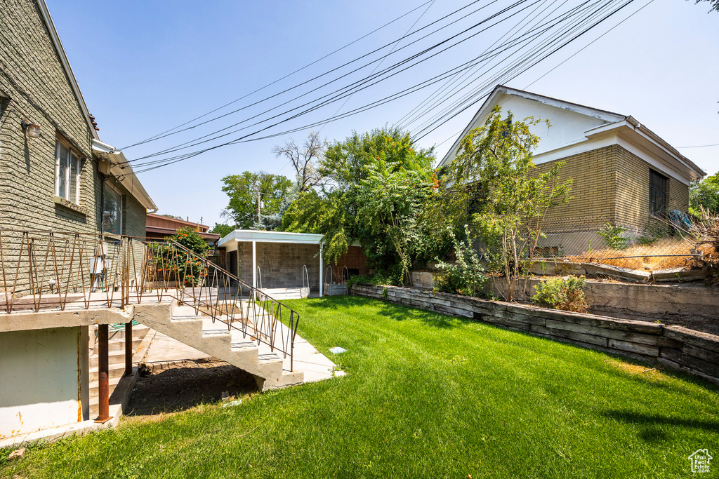 View of yard featuring a sunroom