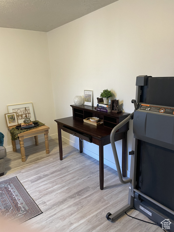 Office space featuring light wood-type flooring