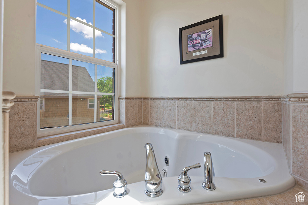 Bathroom with tiled tub