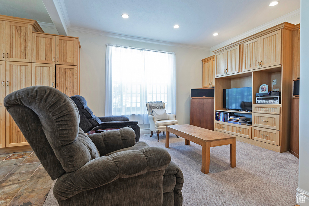 Tiled living room featuring crown molding