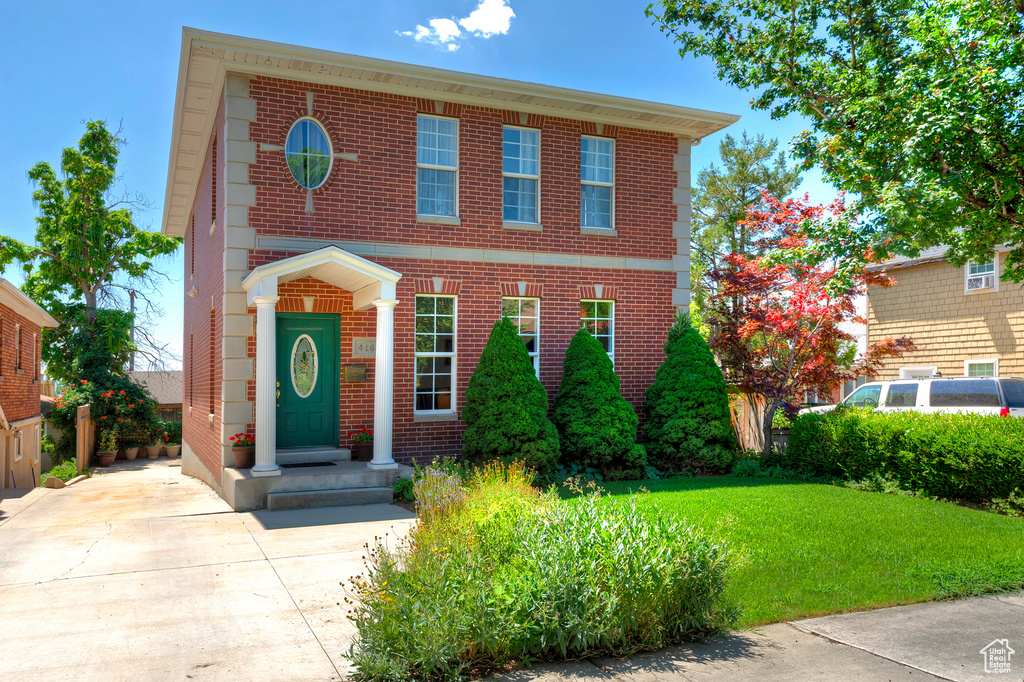 View of front of property with a front lawn