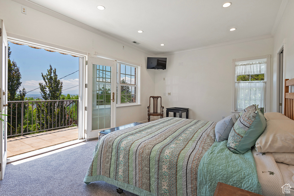 Carpeted bedroom with access to exterior and crown molding