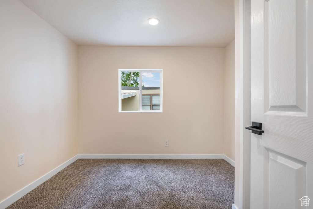 Unfurnished room featuring carpet flooring