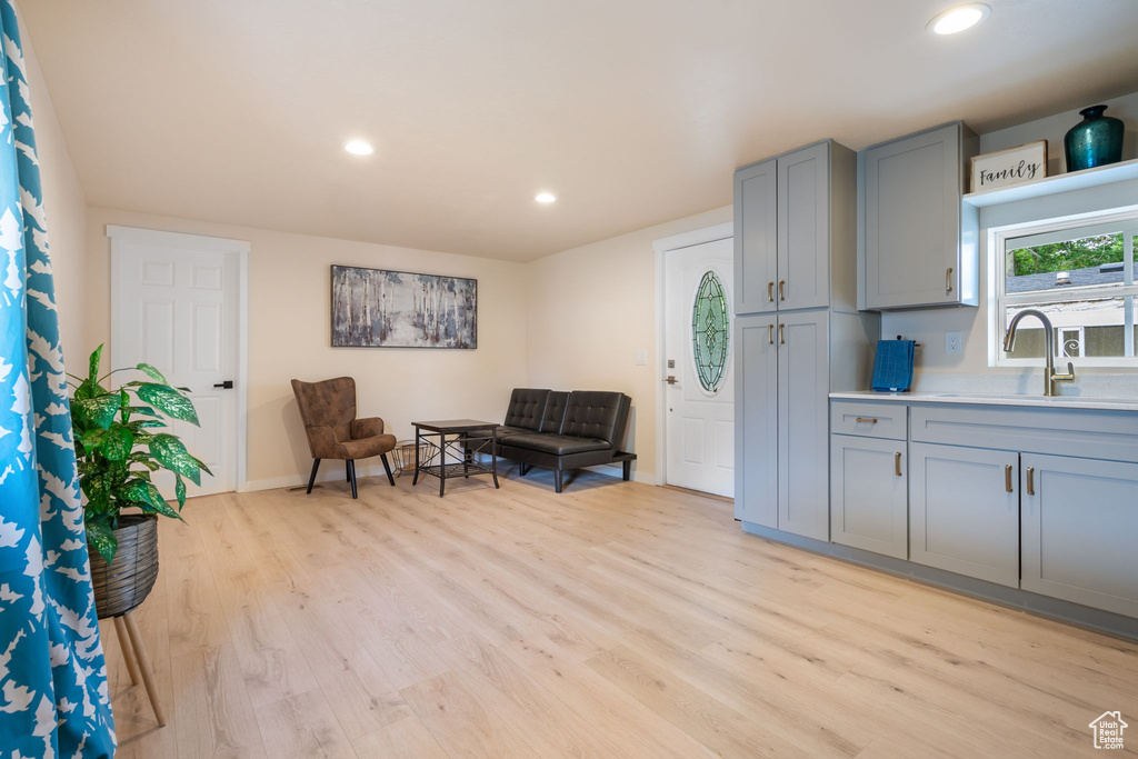 Living area featuring light hardwood / wood-style floors and sink