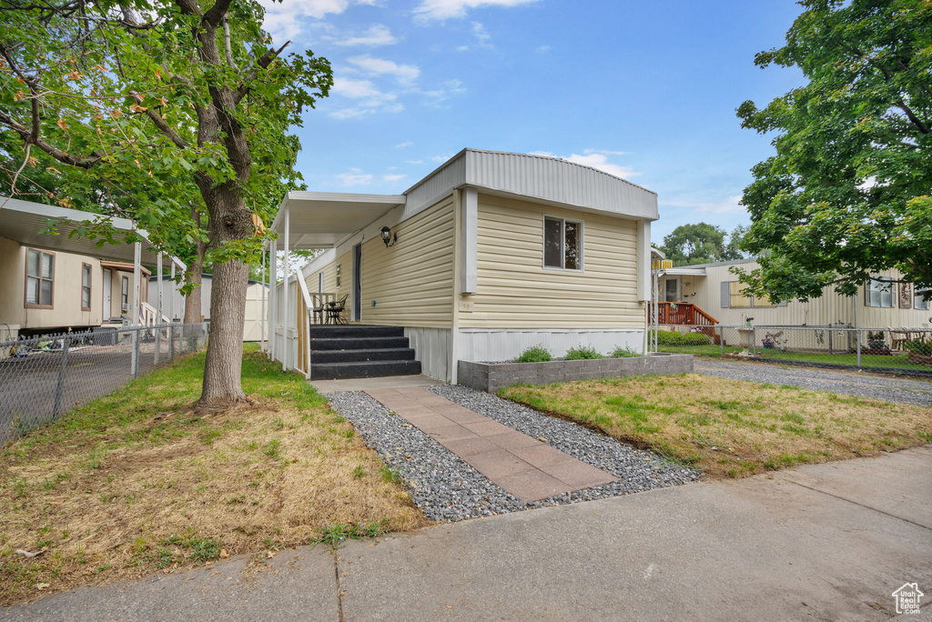 View of front of property with a front lawn