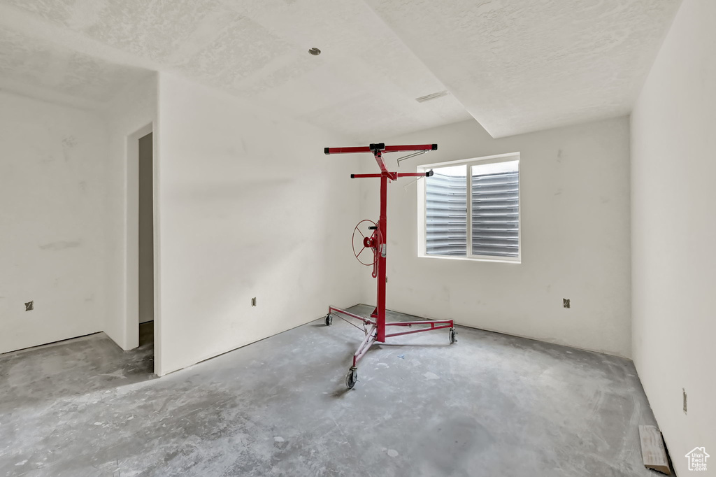 Workout area with a textured ceiling