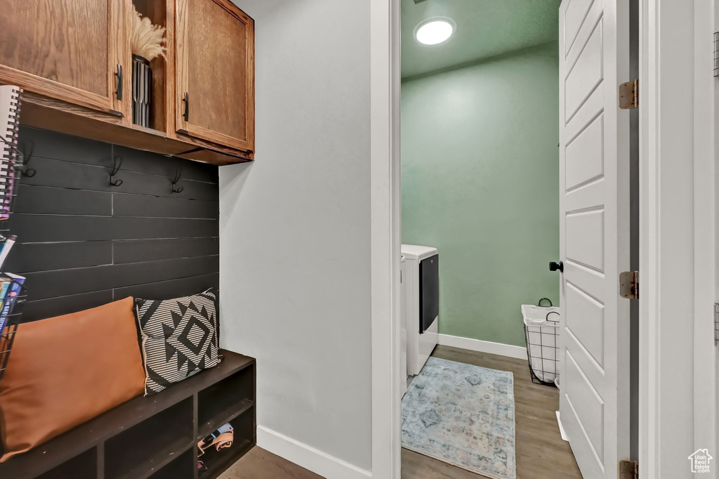 Mudroom with wood-type flooring