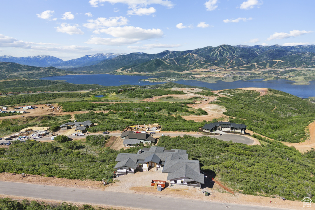 Drone / aerial view with a water and mountain view