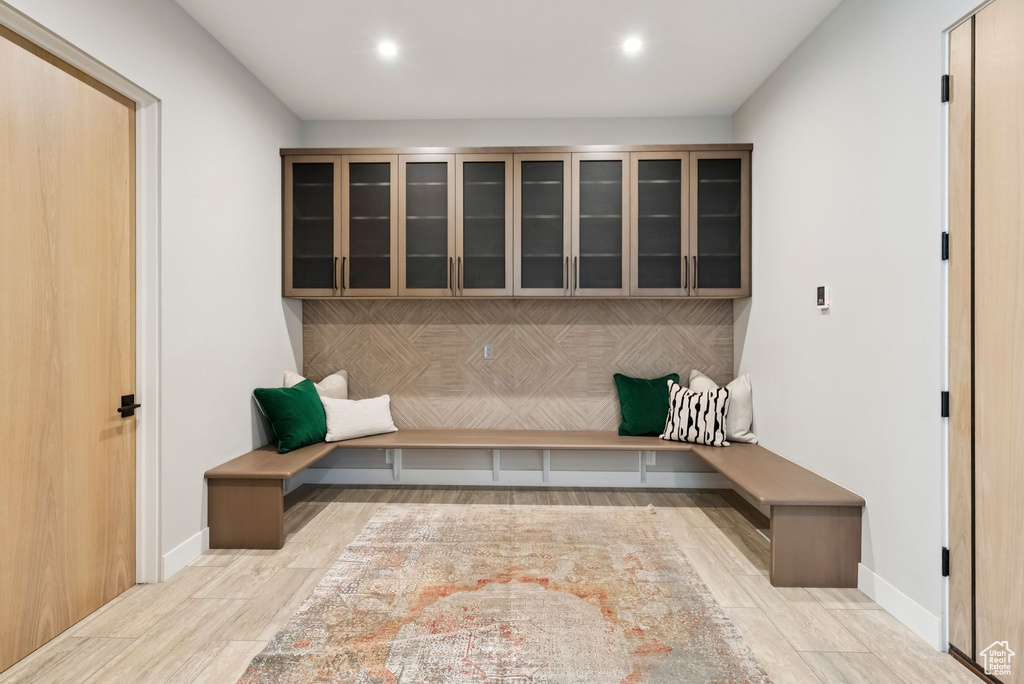 Mudroom with wood finished floors and recessed lighting
