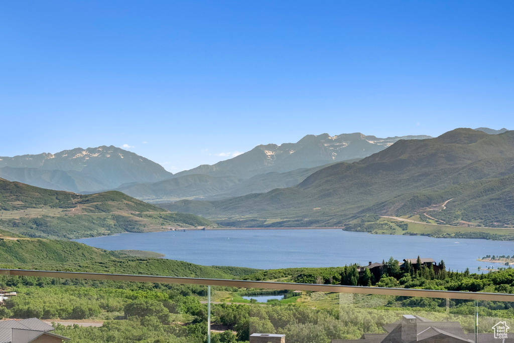 View of mountain backdrop featuring a nearby body of water