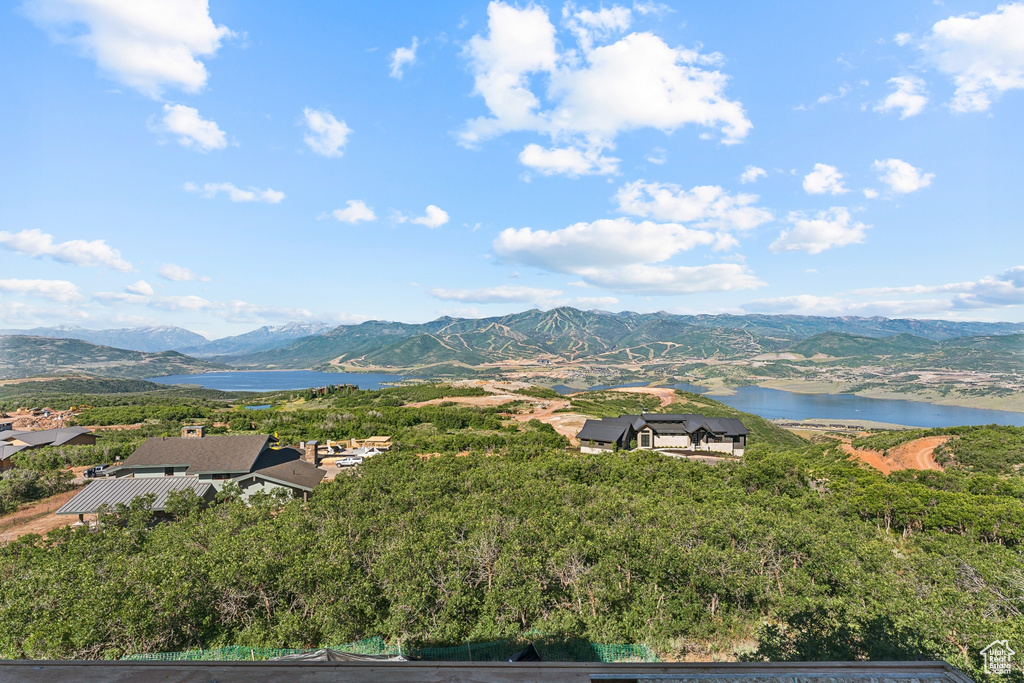 Property view of mountains with a water view