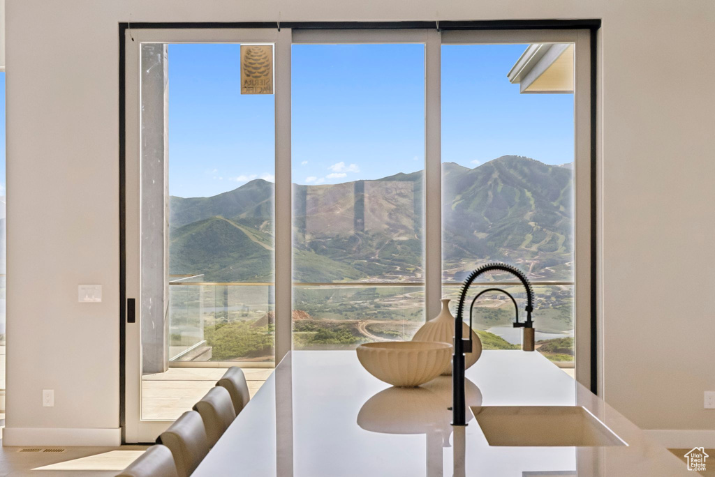 Dining room with plenty of natural light and a mountain view