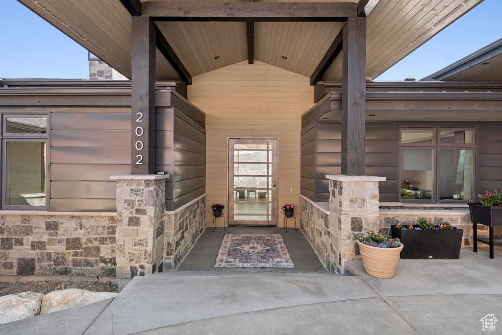 View of exterior entry with stone siding
