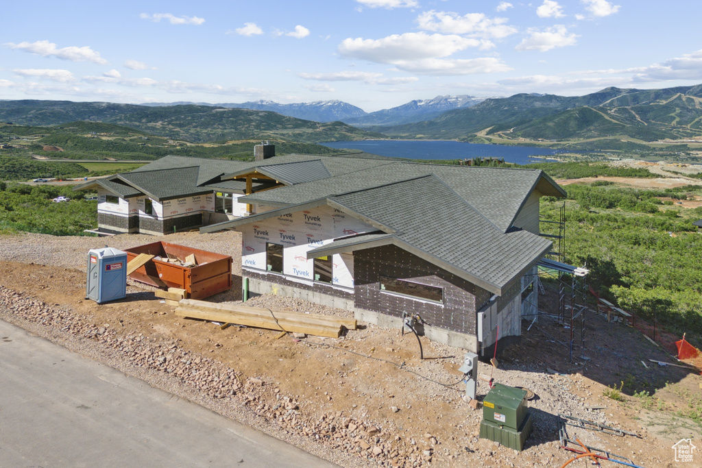 Bird\'s eye view with a water and mountain view