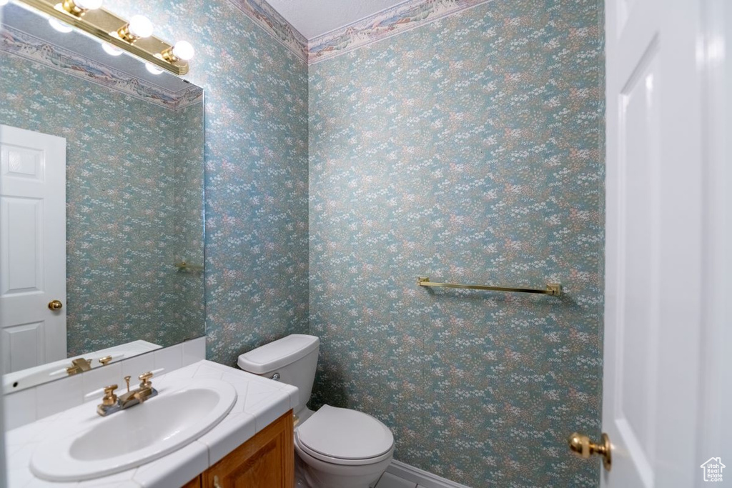 Bathroom with vanity and toilet