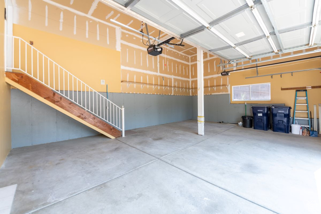 Garage featuring a garage door opener