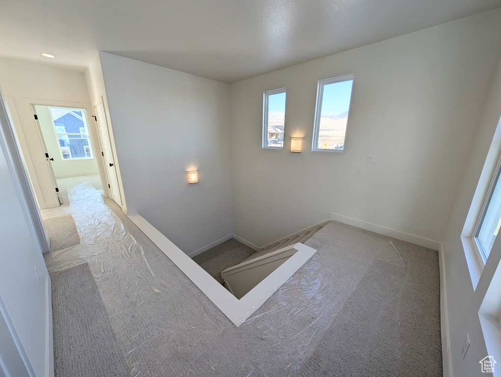 Interior space featuring light colored carpet