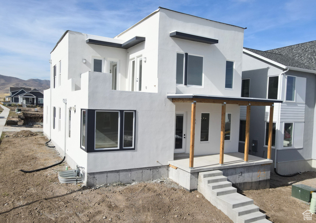 View of front of house featuring a mountain view