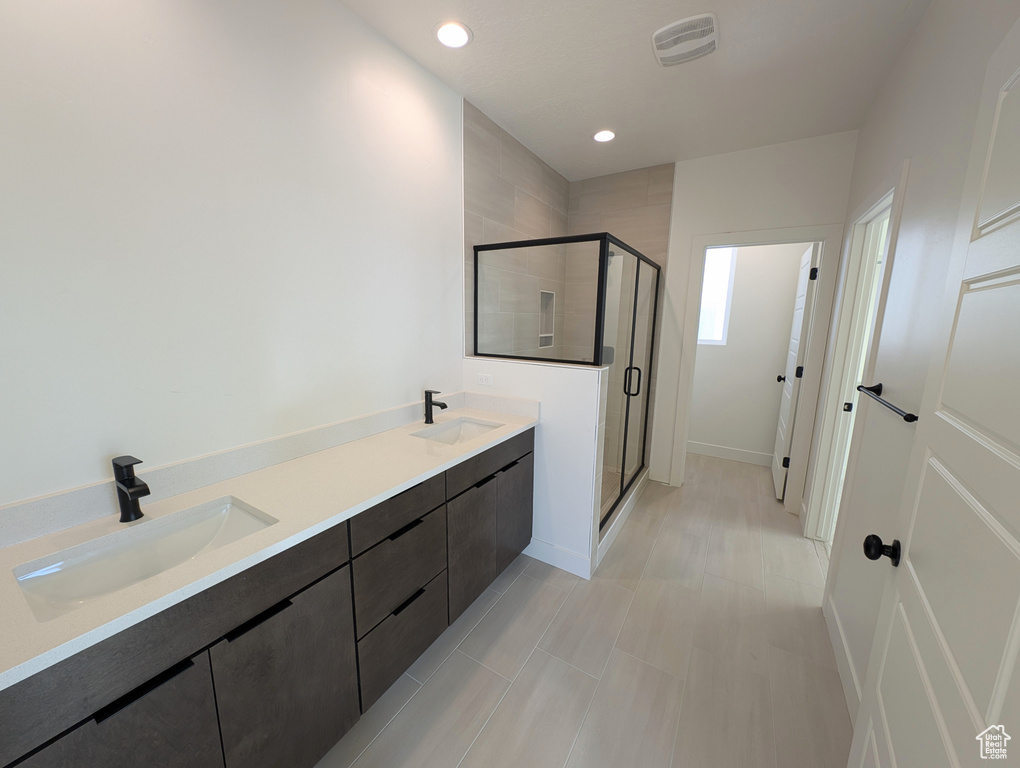 Bathroom with vanity and an enclosed shower