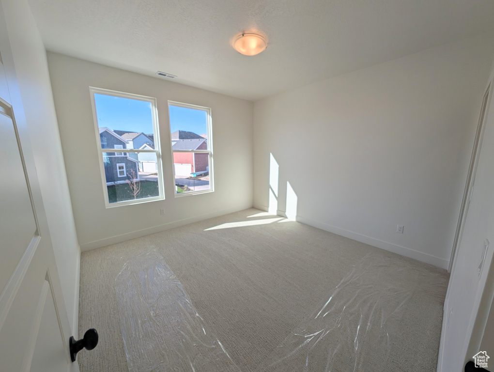 View of carpeted spare room