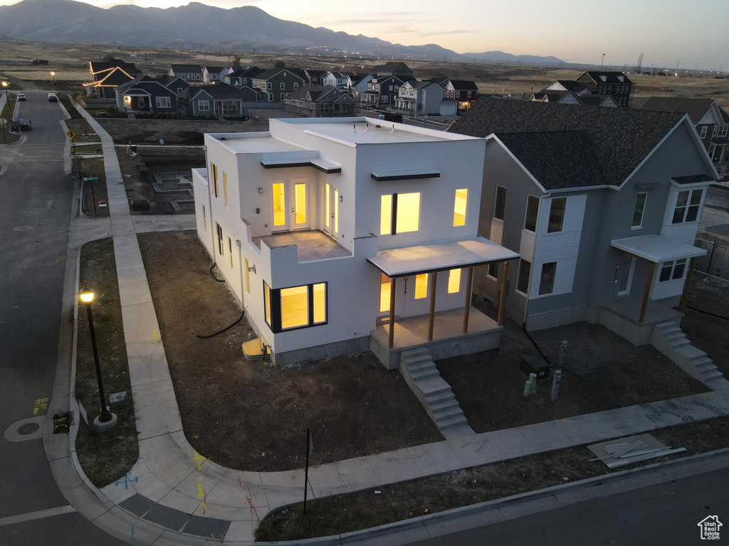 Aerial view at dusk featuring a mountain view