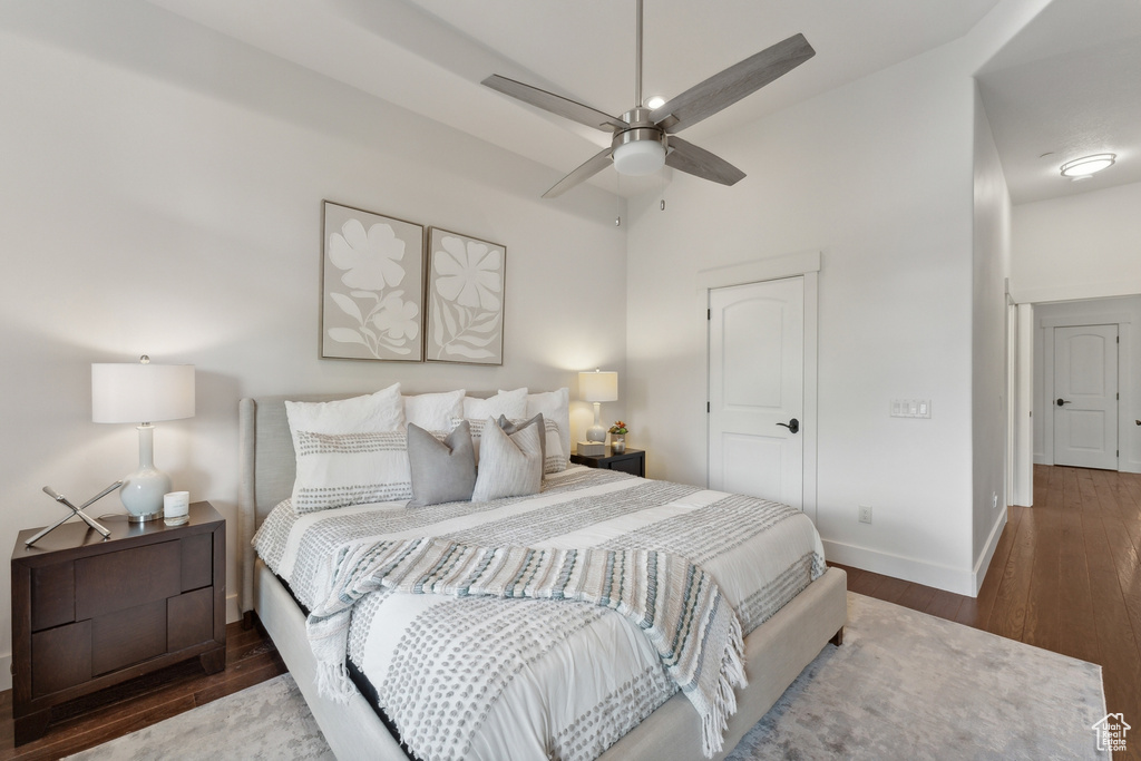 Bedroom featuring wood-type flooring and ceiling fan