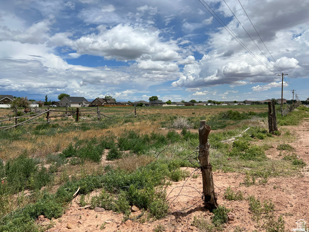 View of yard with a rural view