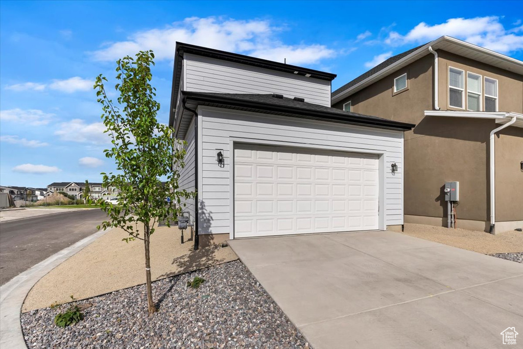 View of front of property featuring a garage