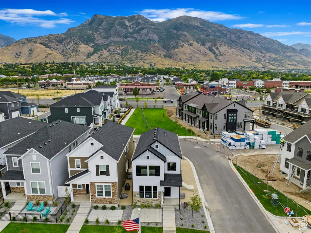 Birds eye view of property with a mountain view