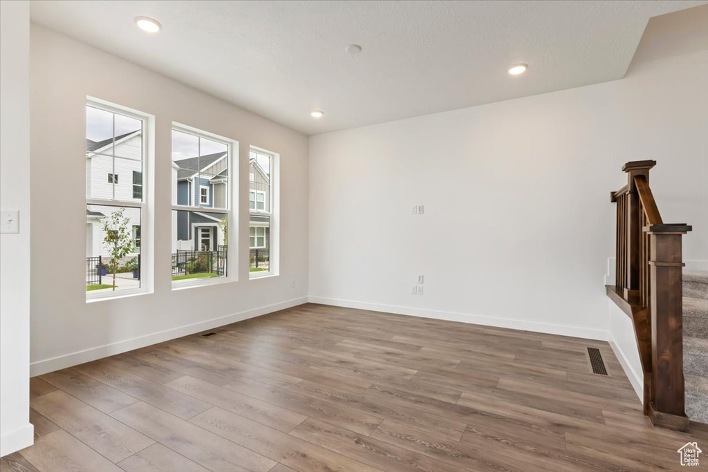 Unfurnished living room featuring wood-type flooring