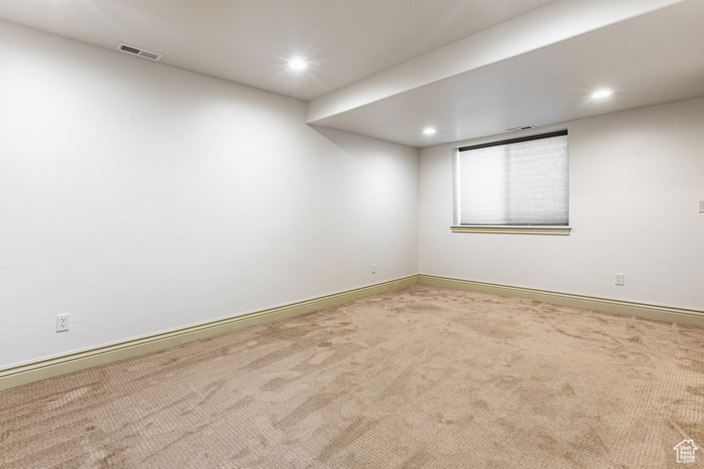 Empty room with carpet flooring