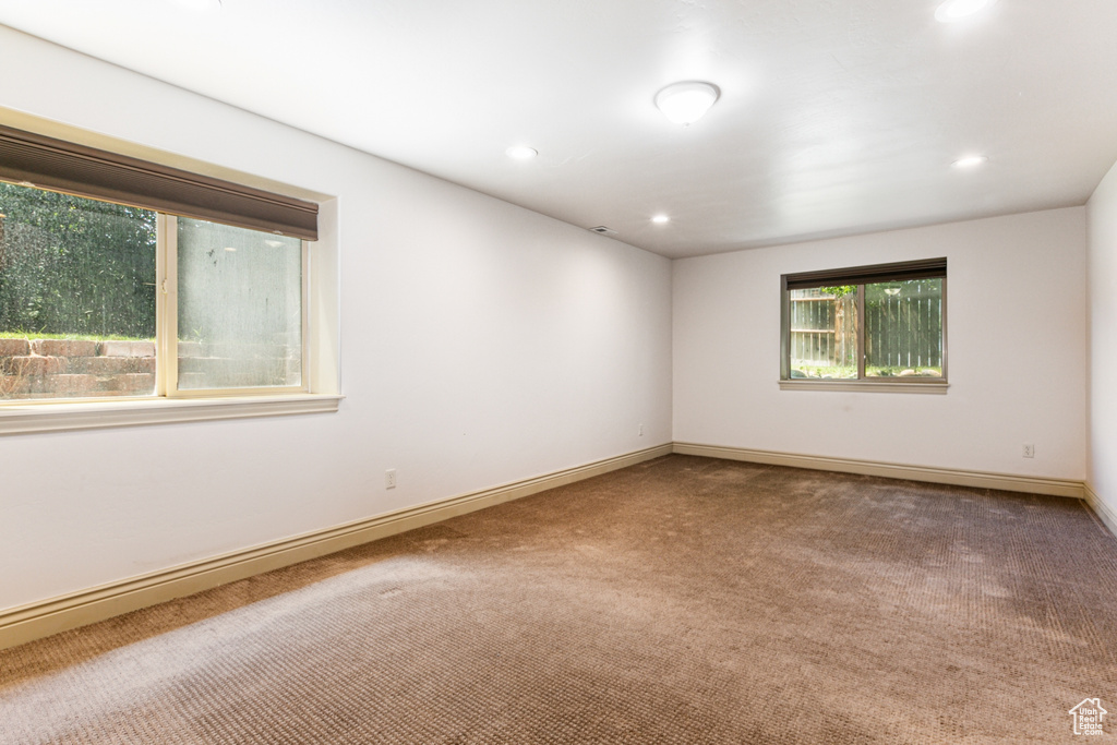 Empty room with carpet floors