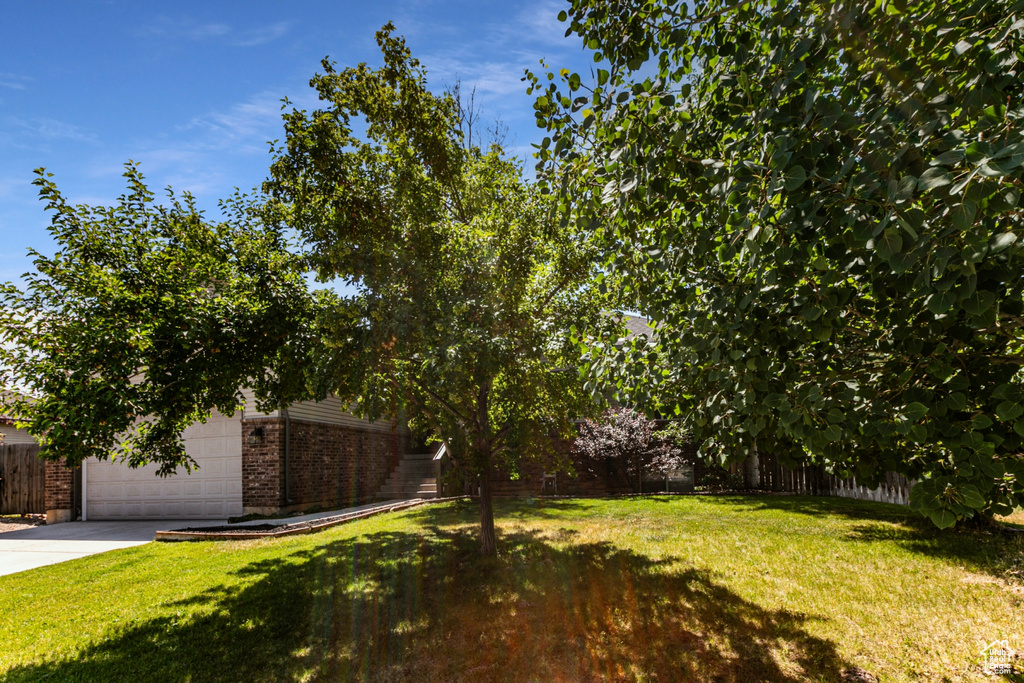 View of yard with a garage