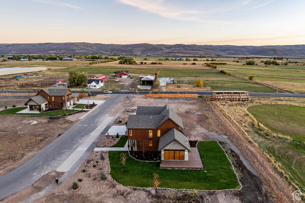 Aerial view at dusk with a mountain view and a rural view