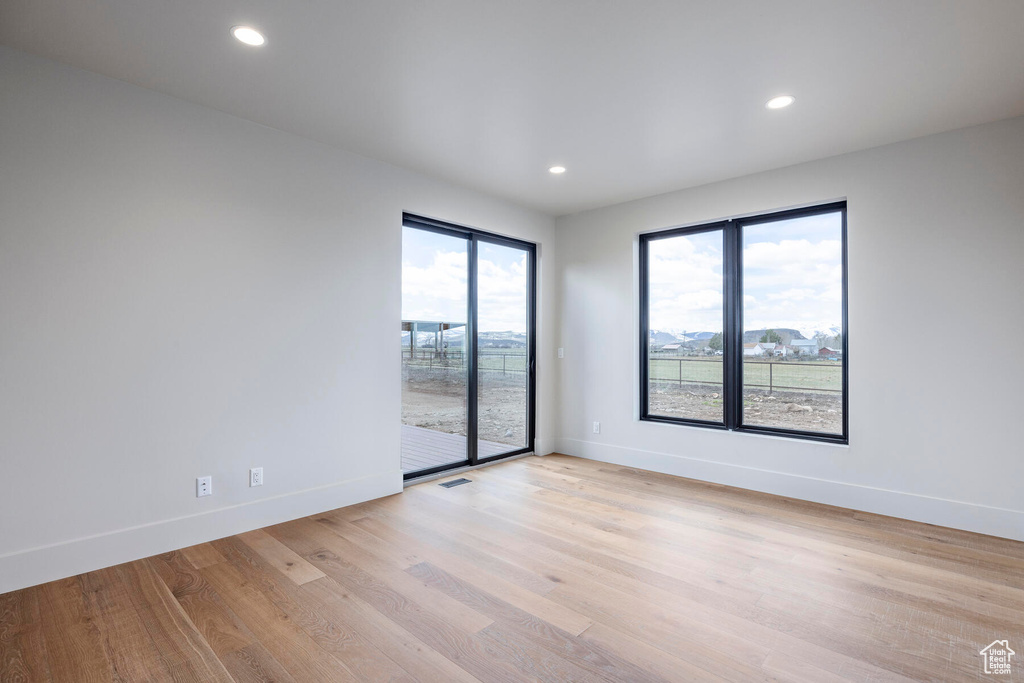 Spare room with light hardwood / wood-style flooring