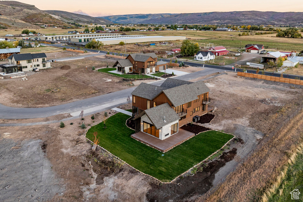 Aerial view at dusk featuring a mountain view