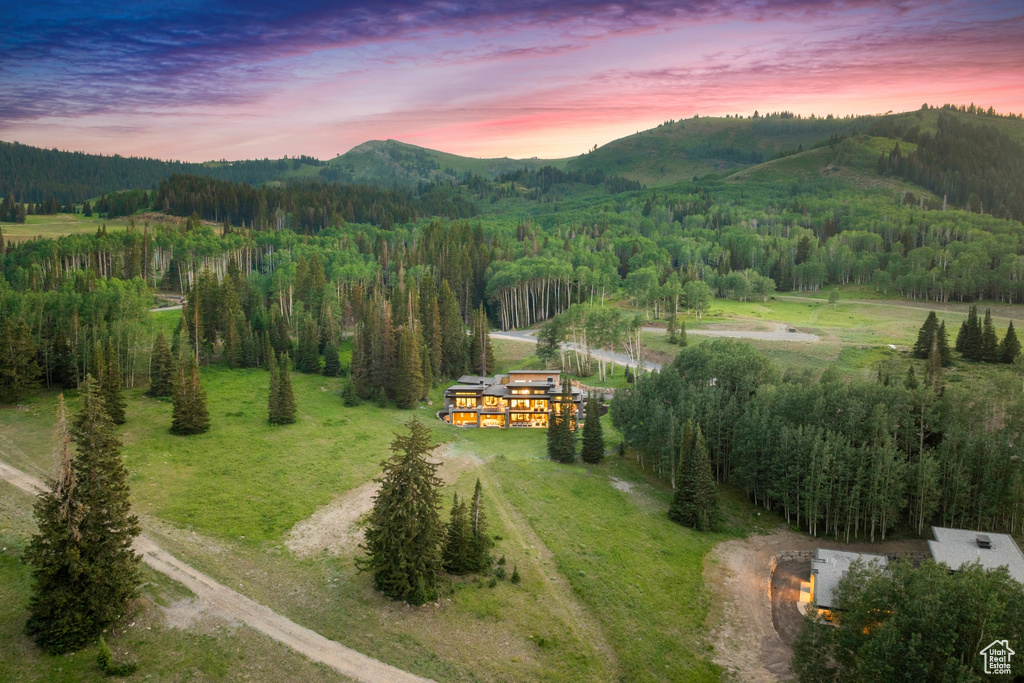 Aerial view at dusk with a mountain view and a rural view