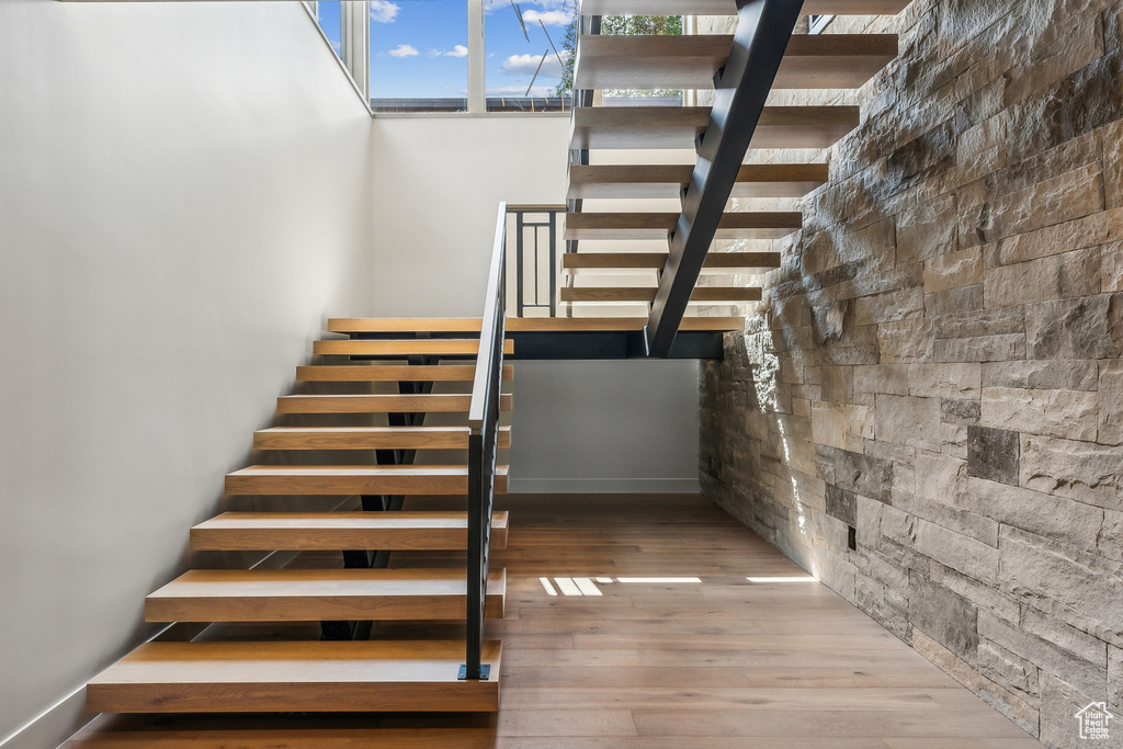 Stairway with hardwood / wood-style floors